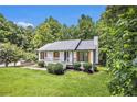 Beautiful home with a well-manicured lawn and a welcoming front porch at 129 Fawn Trail Trl, Hiram, GA 30141