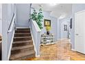 Inviting foyer with staircase, elegant tile flooring, stylish console table, and decorative accents at 3832 Augustine Pl, Rex, GA 30273