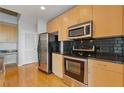 Updated kitchen featuring stainless steel appliances and a black tile backsplash at 400 W Peachtree St # 2108, Atlanta, GA 30308
