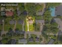 Aerial view of property on 0.2 acres with a well-manicured lawn and mature trees in a neighborhood at 2560 Fairlane Dr, Cumming, GA 30041