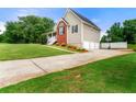 Well-kept home with a spacious driveway, lush lawn, and attached garage, offering convenience and curb appeal at 71 Barrington Dr, Hiram, GA 30141