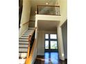 Bright entryway with high ceilings and elegant staircase with wood and iron railing at 3306 Chastain Ridge Dr, Marietta, GA 30066