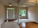Inviting entryway featuring a bright interior, with hardwood floors and neutral carpeting at 3457 Dacite Ct, South Fulton, GA 30349