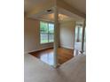 Open living space featuring hardwood floors, and large windows that allow in natural light at 3457 Dacite Ct, South Fulton, GA 30349