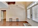Airy foyer with wood floors, a high ceiling, and lots of natural light at 4395 Wildbrooke Pkwy, Cumming, GA 30041