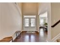 Bright foyer with hardwood floors and an open view to the living spaces at 4395 Wildbrooke Pkwy, Cumming, GA 30041