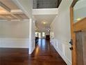 Grand foyer with hardwood floors, wainscoting, and an open view to the living spaces at 1264 Brynhill Ct, Buford, GA 30518
