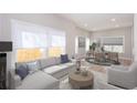 Inviting living room showcasing natural light, comfortable seating, and open-concept design at 3286 Bachelor Street, East Point, GA 30344