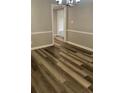 Dining Room exhibiting new wood flooring, modern wall trim and neutral paint at 188 Rue Fontaine, Lithonia, GA 30038