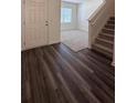 Inviting foyer with hardwood flooring and a staircase leading to the upper level at 34 Sonoma Drive, Dallas, GA 30157
