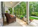 Cozy covered porch featuring comfortable seating and lush greenery, perfect for relaxation at 5015 Monticello Dr, Villa Rica, GA 30180