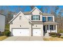 Charming two-story home with a brick facade, two-car garage, and inviting front porch at 2536 Dayview Ln, Atlanta, GA 30331