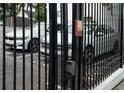 View of a security gate featuring steel bars with a keypad and car entrance, ensuring privacy and security at 108 Park Pl # 108, Atlanta, GA 30030