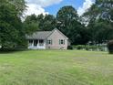 Inviting single-story home on a large lot with mature trees and well-manicured lawn at 10 Vaughan Ne Ct, Cartersville, GA 30121