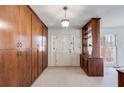 Hallway with built-in storage cabinets with decorative light fixture at 6339 Cornelia Dr, Douglasville, GA 30134