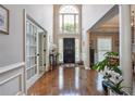 Elegant foyer featuring hardwood floors, soaring ceilings, and an abundance of natural light at 775 Gran Heritage Way, Dacula, GA 30019