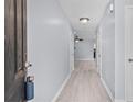 Inviting entrance hall with light wood floors and neutral wall paint at 173 Oakland Hills Way, Lawrenceville, GA 30044
