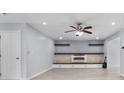Cozy living area with fireplace, custom built-ins, and modern light fixtures at 173 Oakland Hills Way, Lawrenceville, GA 30044