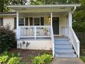 Inviting front porch with a classic porch swing, creating a relaxing outdoor space at 1003 Valley Se Dr, Smyrna, GA 30080