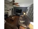 Cozy living room boasts modern decor, hardwood floors, and ample seating for relaxation at 2591 Perkerson Dr, Austell, GA 30168