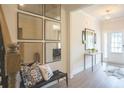 Bright entryway with modern decor, stylish mirrors, and a charming bench at 525 Paces Dr, Lithia Springs, GA 30122