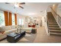 Open concept living space with a view of the modern kitchen and staircase at 525 Paces Dr, Lithia Springs, GA 30122