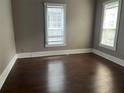 Bedroom with hardwood floors and two large windows offering plenty of natural light at 3155 E East Point E St, East Point, GA 30344