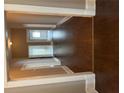 Bright hallway featuring hardwood floors and white trim on the upper and lower trim at 3155 E East Point E St, East Point, GA 30344