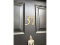 Close-up of a stylish front door featuring the house number '37' at 2340 Beaver Ruin Rd # Un37, Norcross, GA 30071