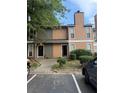 Inviting townhome exterior with charming landscaping and convenient parking at 2340 Beaver Ruin Rd # Un37, Norcross, GA 30071