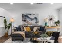 Bright and airy living room with modern decor, a plush sofa, and ample natural light at 502 Bridge Se Ln, Smyrna, GA 30082