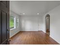 Bright living room featuring hardwood floors and natural light from large windows at 5861 Community Rd, Mableton, GA 30126