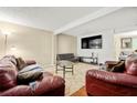 Inviting living room featuring a large screen TV and plush seating area at 2323 Wingfoot Pl, Decatur, GA 30035