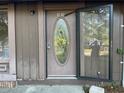 A close up of the front door with oval glass insert and sidelight at 33 Drew Ct, Jonesboro, GA 30238