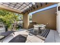 Rooftop patio boasts outdoor dining under pergola, and sun loungers create a relaxing and stylish space for entertaining at 1099 North Ne Ave # 11, Atlanta, GA 30307