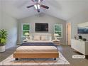 Bright staged main bedroom features a comfortable bed, modern decor, and ample natural light at 110 Silverthorne Dr, Douglasville, GA 30134