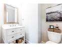Cozy half-bathroom has a white vanity and modern decorations at 3133 Quinn Pl, Atlanta, GA 30341