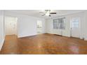 Open living room featuring hardwood floors, neutral paint and a ceiling fan at 300 Peachtree Ne St # 5A, Atlanta, GA 30308