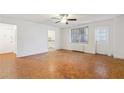 Large living room featuring classic parquet floors, neutral paint and natural light at 300 Peachtree Ne St # 5A, Atlanta, GA 30308