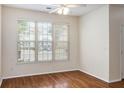 Bright living room featuring a large window with wood floors and light colored walls at 2284 Nicole Dr, Hampton, GA 30228