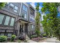 Charming townhome exterior with brick facade, well-manicured landscaping, and a welcoming entrance at 383 Pratt Se Dr # 503, Atlanta, GA 30315