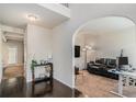 Open foyer with hardwood floors flowing into a living room with comfortable seating at 6918 Diamond Dr, Rex, GA 30273