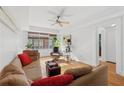 Bright living room with large window, comfortable sofa, and ceiling fan at 1026 Saint Charles Ne Ave # 8, Atlanta, GA 30306
