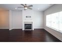 Bright living room with dark hardwood floors and a tiled fireplace at 2163 Wiggins Walk, Atlanta, GA 30316