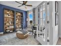 Bright home office with a bookcase, large windows, and comfortable seating at 522 Regency Trl, Acworth, GA 30102