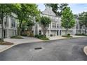 Inviting exteriors showcasing garages, walkways, and mature trees at 1154 Village Se Ct, Atlanta, GA 30316