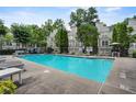 Community pool with lounge chairs and tables for relaxation at 1154 Village Se Ct, Atlanta, GA 30316