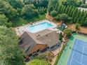 Overhead shot of community pool, clubhouse, tennis courts and lounge area at 3436 Laurelwood Ne Ct, Roswell, GA 30075
