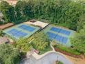 Aerial shot of well-maintained tennis courts offering a great recreational amenity at 3436 Laurelwood Ne Ct, Roswell, GA 30075