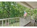 Inviting porch offering views of the surrounding landscape, a peaceful retreat at 1341 Little Deer Run, Canton, GA 30114